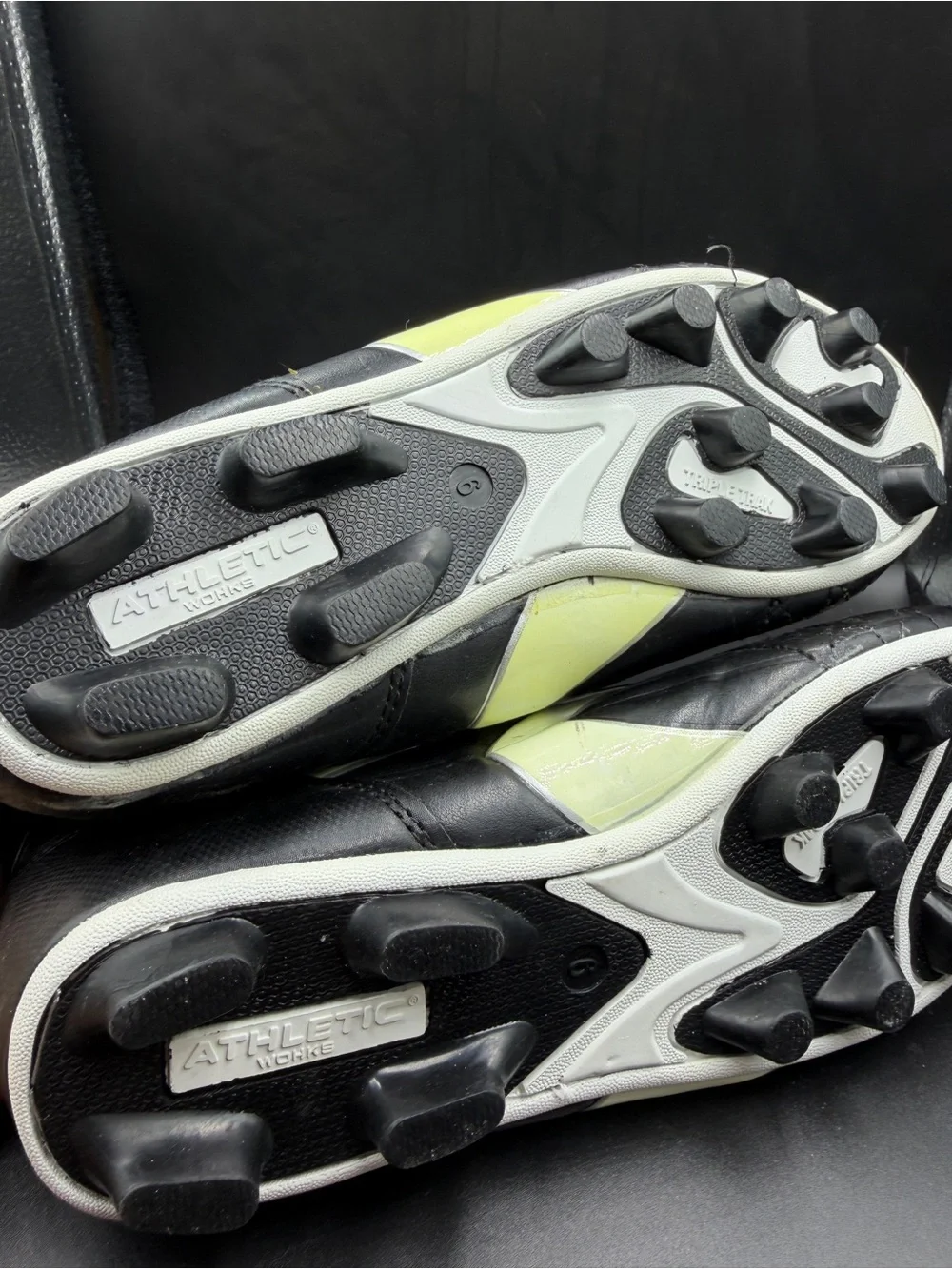 Men's Black Athletic Cleats with Yellow Accent
